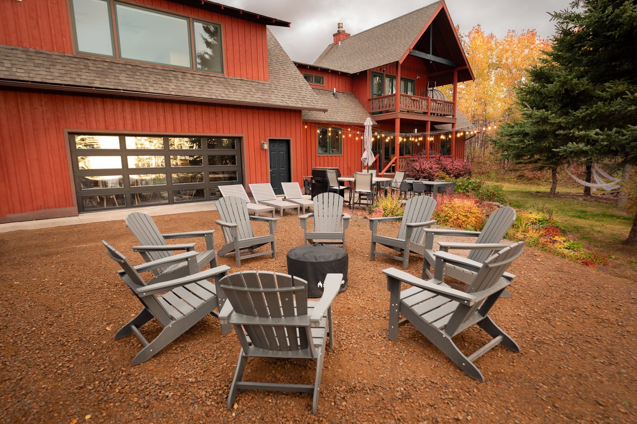 Fire pit — sun loungers, Adirondack chairs, lake views