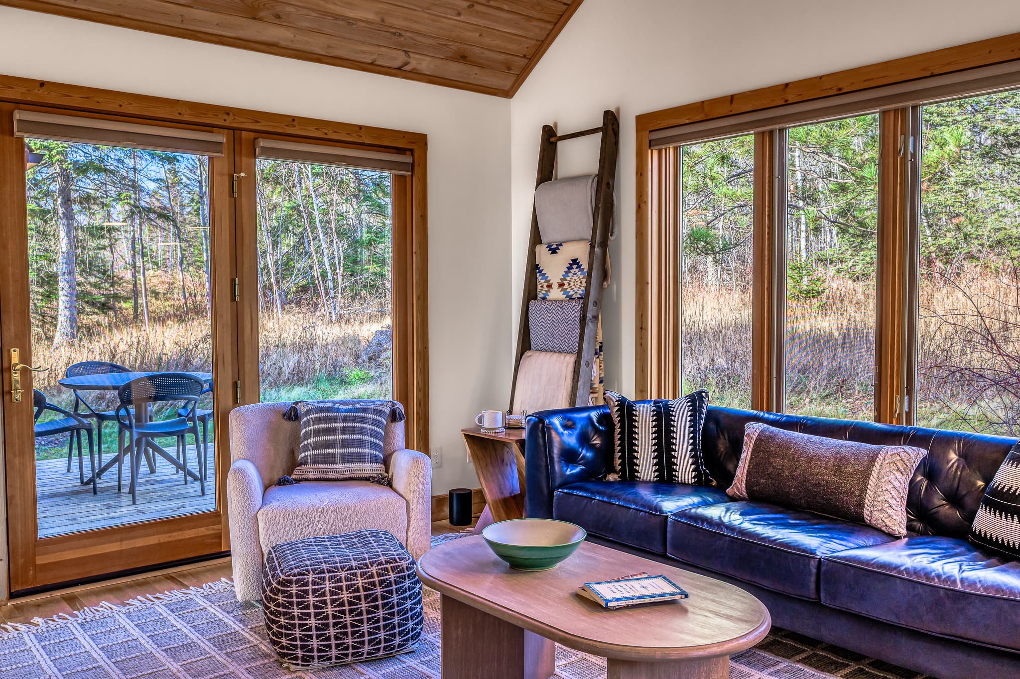 Living room — cozy blankets, natural light, fireplace