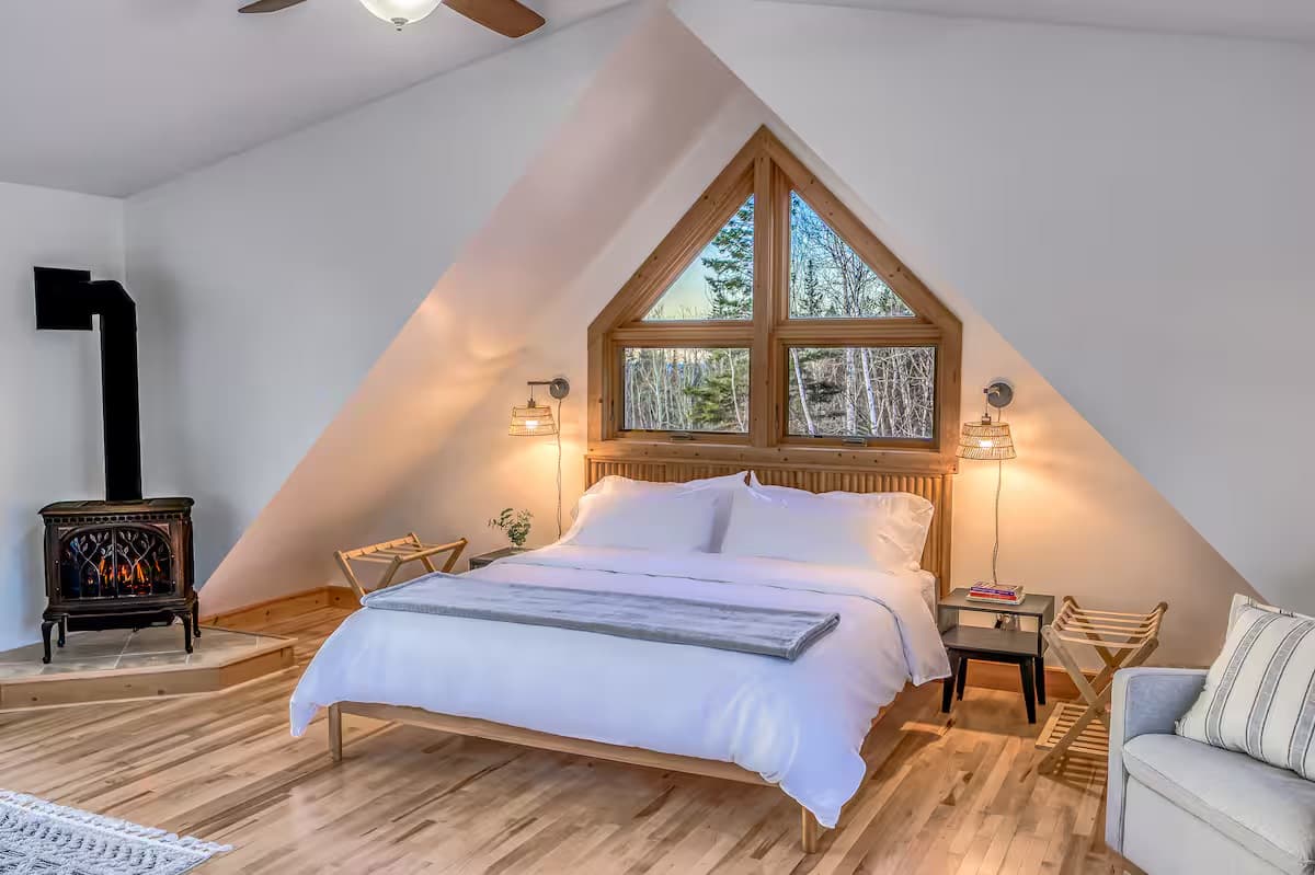 Bedroom 1 — king bed, fireplace & Lake Superior views