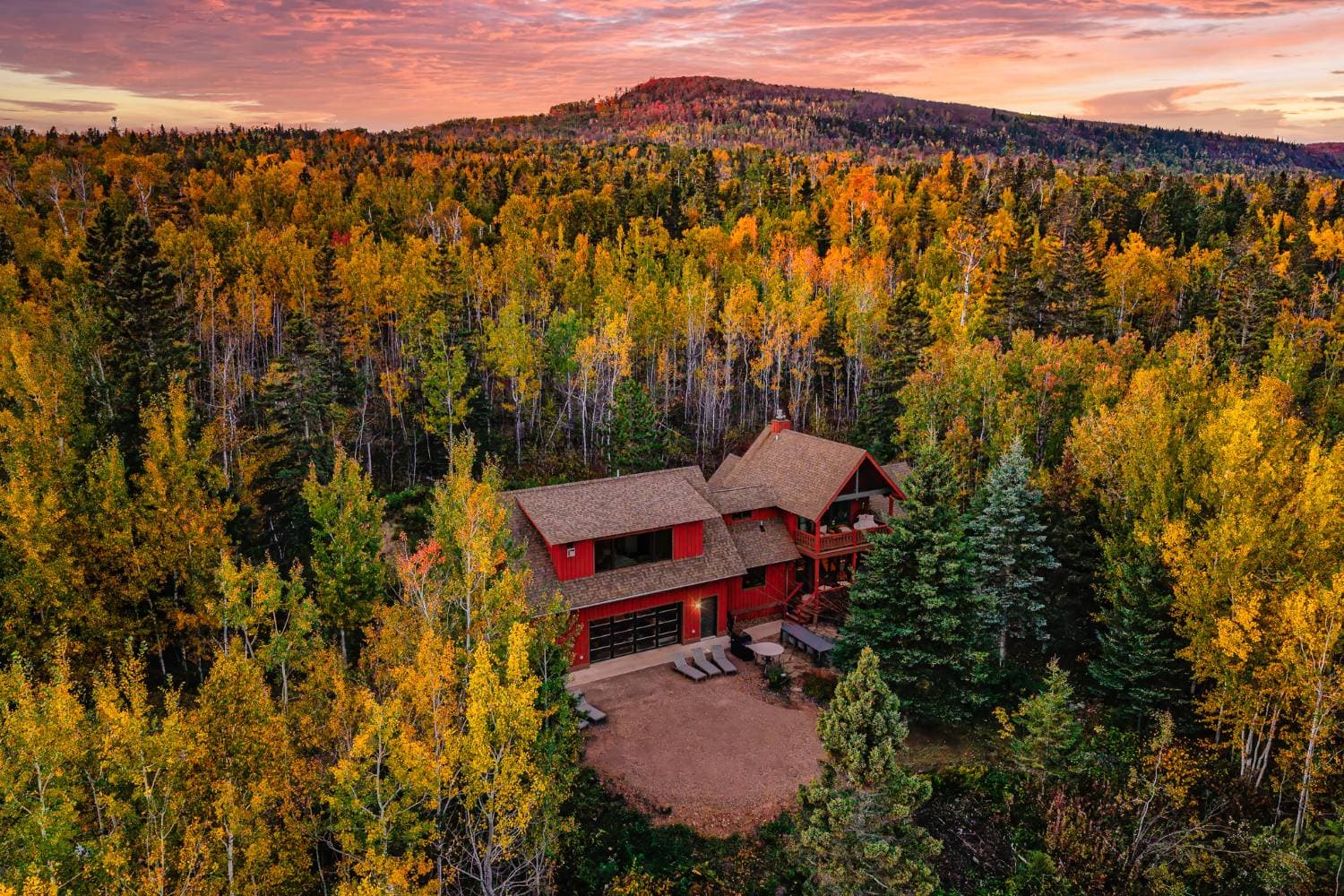 Aerial view of Overlook Hus among the fall colors at sunset, Tofte Minnesota